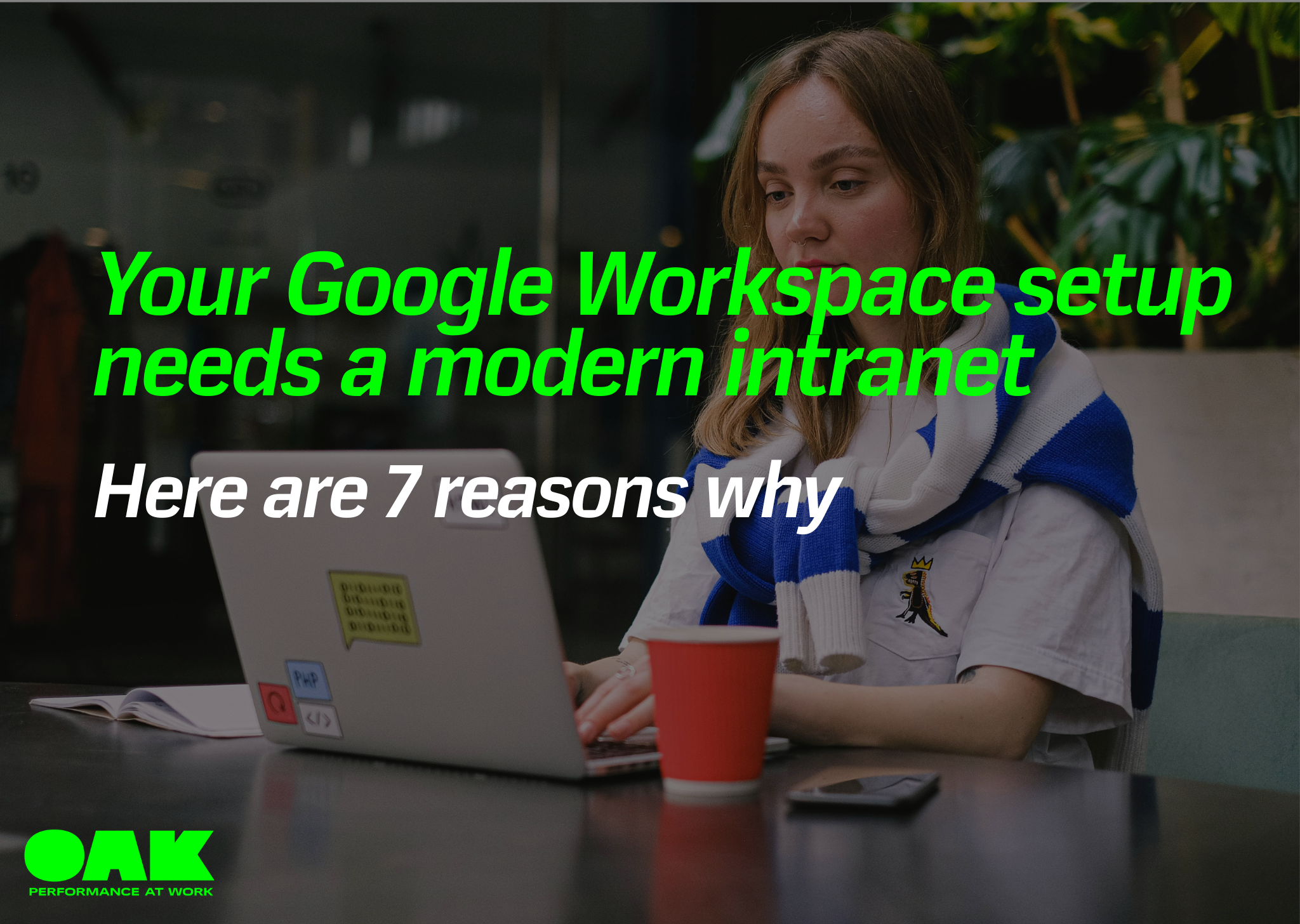 woman sat at laptop with overlay text: your google workspace setup needs a modern intranet here are 7 reasons why